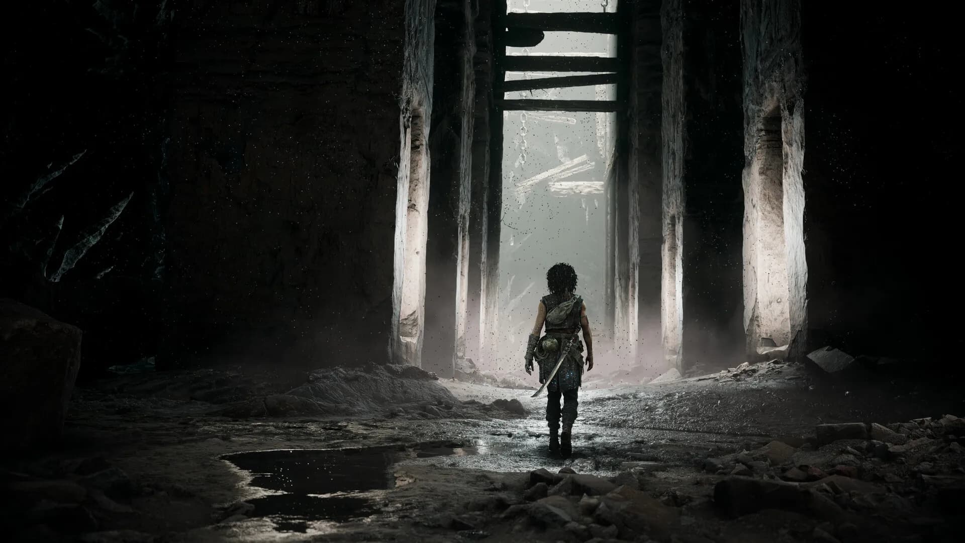 Sophia approaches a bright opening inside the dark ruins in an official screenshot